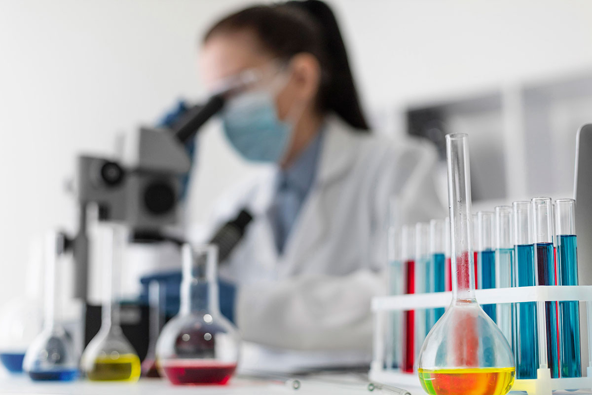 blurry-woman-looking-through-microscope